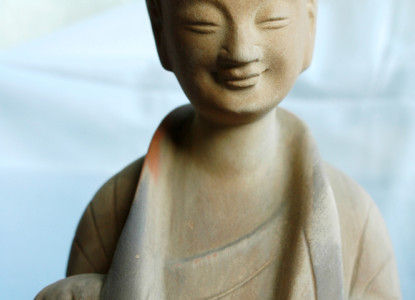 Smiling buddha sculpture